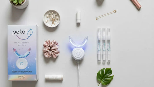 Aesthetic flatlay of LED whitening system and beauty essentials