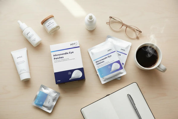 Petal eye patches with skincare routine essentials flat lay.