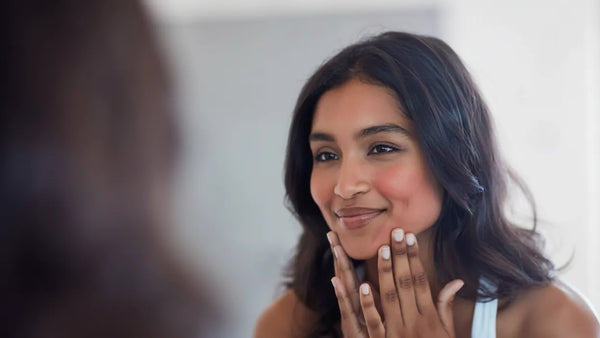 Woman with sensitive skin caring for face after microneedling
